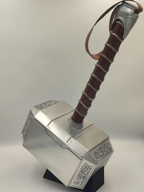 Thor Hammer from the movie, Thor the Dark world. Custom 3d printed, made with leather and automotive paints.